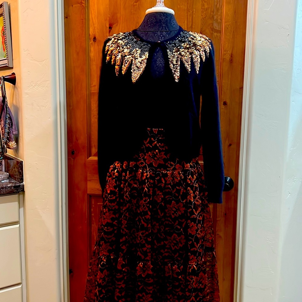 This is an IB diffusion sweater  carol little skirt